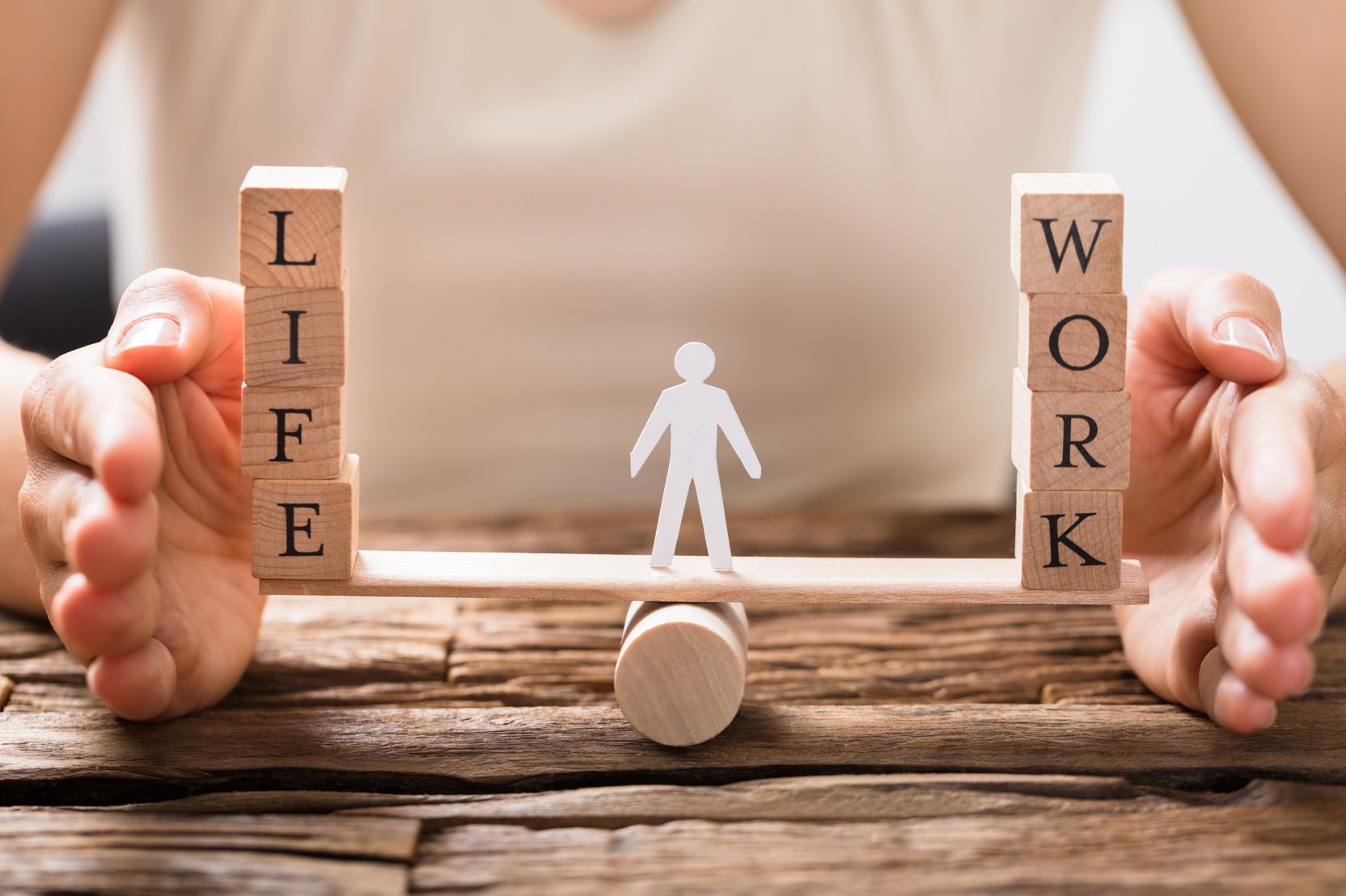 Human Hand Protecting Balance Between Life And Work